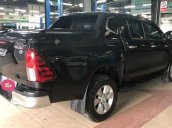 Cần bán gấp Toyota Hilux 3.0G 4X4 đời 2015, màu đen số tự động, 708 triệu