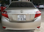 Bán Toyota Vios E 1.5MT màu vàng cát, số sàn, biển Sài Gòn sản xuất 2016 mẫu mới