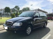 Cần bán lại xe Kia Carnival đời 2009, màu đen, giá chỉ 295 triệu