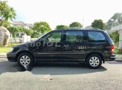 Cần bán lại xe Kia Carnival đời 2009, màu đen, giá chỉ 295 triệu