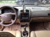 Gia đình cần bán Ford Laser 1.8 SX 2005, số sàn, màu vàng cát còn mới