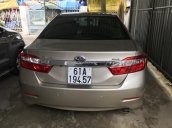 Bán Toyota Camry 2.0E màu vàng cát số tự động sản xuất T12/2014 biển Bình Dương lăn bánh đúng 39000km