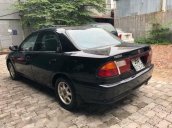 Bán ô tô Mazda 323 đời 1999, màu đen còn mới, giá 88tr