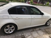 Đổi xe cần bán BMW 320i đăng ký 12/2009, màu trắng còn mới tinh