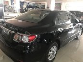 Cần bán gấp Toyota Corolla altis đời 2009, màu đen như mới