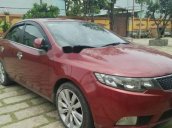 Cần bán lại xe Kia Forte AT đời 2011, màu đỏ, xe nhà đi nên giữ rất kĩ