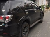 Cần tiền bán Fortuner 2015, số tự động, hai cầu, màu đen, ít sử dụng