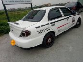 Cần bán Kia Spectra năm 2004, màu trắng, xe đẹp, chạy êm ổn định