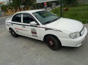 Cần bán Kia Spectra năm 2004, màu trắng, xe đẹp, chạy êm ổn định