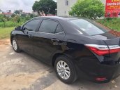 Cần bán lại xe Toyota Corolla altis 1.8E MT đời 2017, màu đen, giá tốt