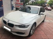 Cần bán xe BMW 320i đời 2013 số auto, màu trắng zin 99%