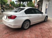 Cần bán xe BMW 320i đời 2013 số auto, màu trắng zin 99%