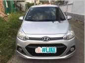 Cần bán gấp Hyundai Grand i10 1.25AT sản xuất 2014, màu bạc, xe nhập