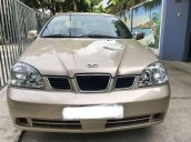 Cần bán xe Daewoo Lacetti 1.6MT năm sản xuất 2004, màu vàng, máy nổ êm ru