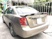 Cần bán xe Daewoo Lacetti 1.6MT năm sản xuất 2004, màu vàng, máy nổ êm ru