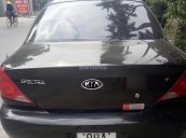 Cần bán Kia Spectra màu đen, đời 2005, xe gia đình bảo quản rất cẩn thận