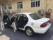 Cần bán Mazda 323 sản xuất năm 2000, màu trắng, nhập khẩu nguyên chiếc, điều hoà rét run