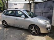 Gia đình bán Kia Carens SX 2010, màu bạc số tự động