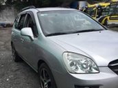 Gia đình bán Kia Carens SX 2010, màu bạc số tự động