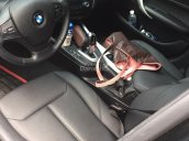 Bán em BMW 116i đời 2013 màu đen, số tự động, 8 cấp