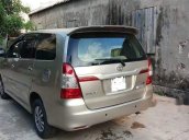 Cần bán lại xe Toyota Innova đời 2014, màu vàng cát