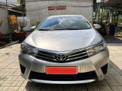 Cần bán Toyota Corolla Altis 1.8G MT đời 2015, màu bạc 