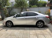 Cần bán Toyota Corolla Altis 1.8G MT đời 2015, màu bạc 