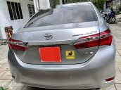 Cần bán Toyota Corolla Altis 1.8G MT đời 2015, màu bạc 