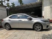 Cần bán Toyota Corolla Altis 1.8G MT đời 2015, màu bạc 