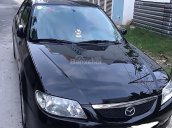 Bán Mazda 323 năm 2004, màu đen xe gia đình