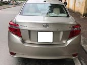 Gia đình bán Toyota Vios E đời 2014, màu vàng cát