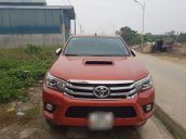 Bán xe Toyota Hilux 3.0 4x4 AT năm 2016, màu đỏ chính chủ