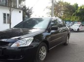 Cần bán xe Mitsubishi Lancer đời 2004, màu đen