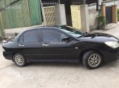 Cần bán xe Mitsubishi Lancer 1.8AT 2003, màu đen cọp