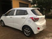 Bán Hyundai Grand i10 MT sản xuất năm 2015, màu trắng, đăng kí lần đầu T12-2015