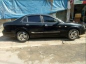 Cần bán xe Daewoo Magnus năm sản xuất 2004, màu đen, máy êm