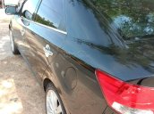 Cần bán Kia Forte 2010, màu đen xe gia đình