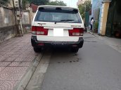 Gia đình bán ô tô Ssangyong Musso đời 2004, màu trắng