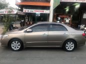 Cần bán lại xe Toyota Corolla altis năm 2009, màu vàng xe gia đình