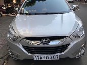 Cần bán Hyundai Tucson 2.0 AT 4WD đời 2010, màu bạc, nhập khẩu