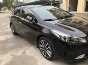 Cần bán Kia Cerato 1.6AT đời 2016, màu đen như mới