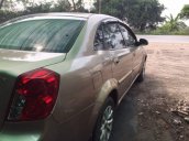 Bán Daewoo Lacetti năm sản xuất 2004, màu vàng, giá 135tr