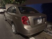 Bán Daewoo Lacetti năm sản xuất 2004, màu vàng, giá 135tr