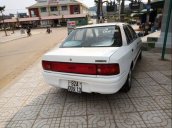 Cần bán gấp Mazda 323 đời 1995, màu trắng, đèn trước sau mới thay, về chỉ việc đi