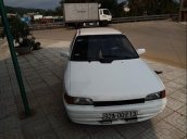 Cần bán gấp Mazda 323 đời 1995, màu trắng, đèn trước sau mới thay, về chỉ việc đi