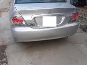 Cần bán xe Mitsubishi Lancer đời 2004, màu bạc, xe đi ít giữ gìn cẩn thận