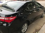 Chính chủ bán xe Toyota Corolla Altis 1.8 đời 2015, màu đen