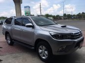 Bán gấp Toyota Hilux 3.0G 4x4 AT đời 2016, màu bạc, xe nhập