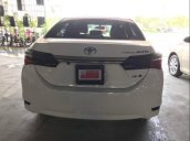 Cần bán gấp Toyota Corolla altis 1.8E CVT sản xuất 2018, màu trắng, xe đẹp 