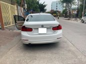 Cần bán xe BMW 320i 2014 ĐK 2015, số tự động màu trắng